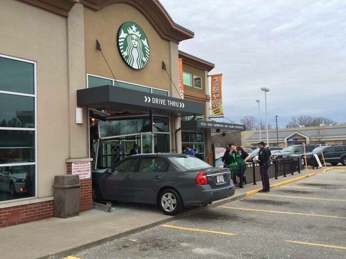 Car mistakenly driven into a coffee shop's drive-thru area, illustrating hilarious misunderstandings in navigation.