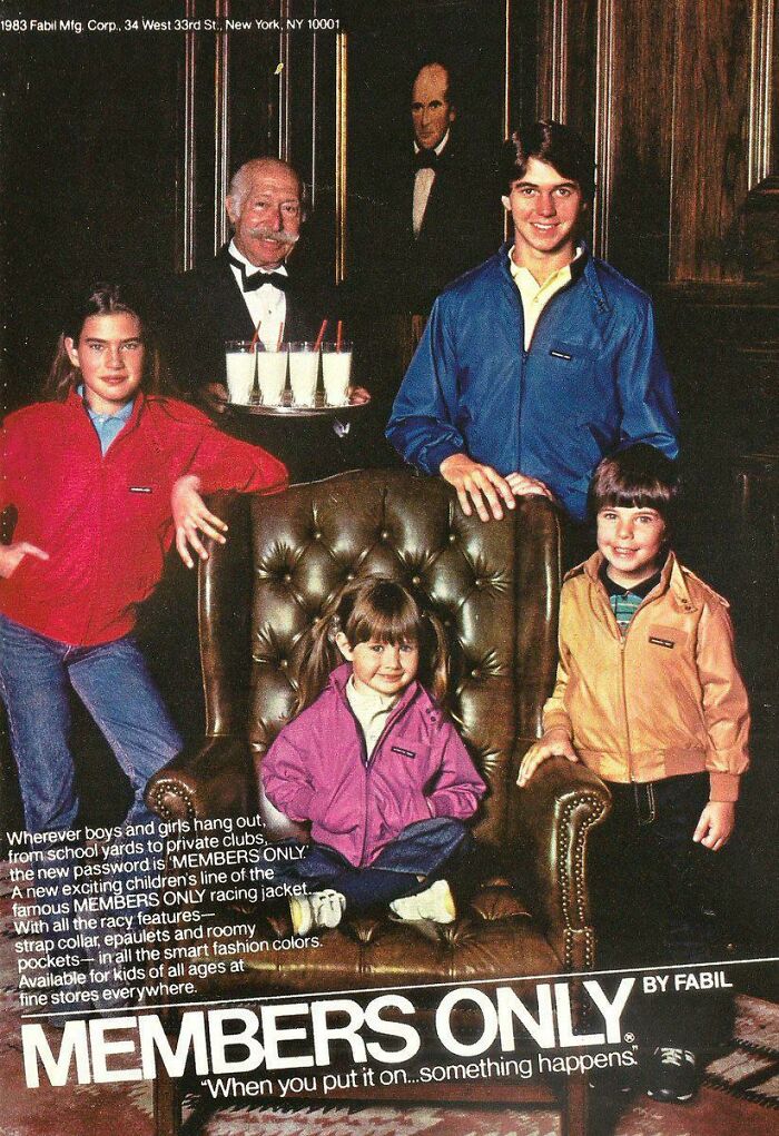 80s fashion trends featuring Members Only jackets on a group in a vintage setting with a waiter holding drinks.