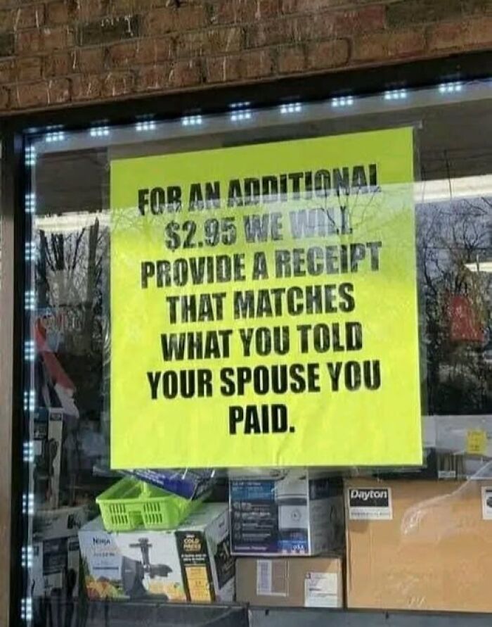 Sign offering fake receipts for a fee, adding humor to bizarre storefronts.