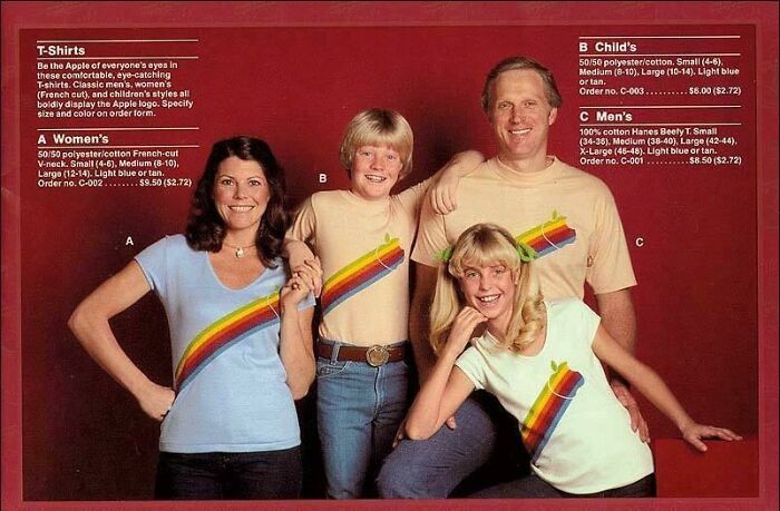 Family wearing 80s fashion T-shirts with rainbow stripe designs.