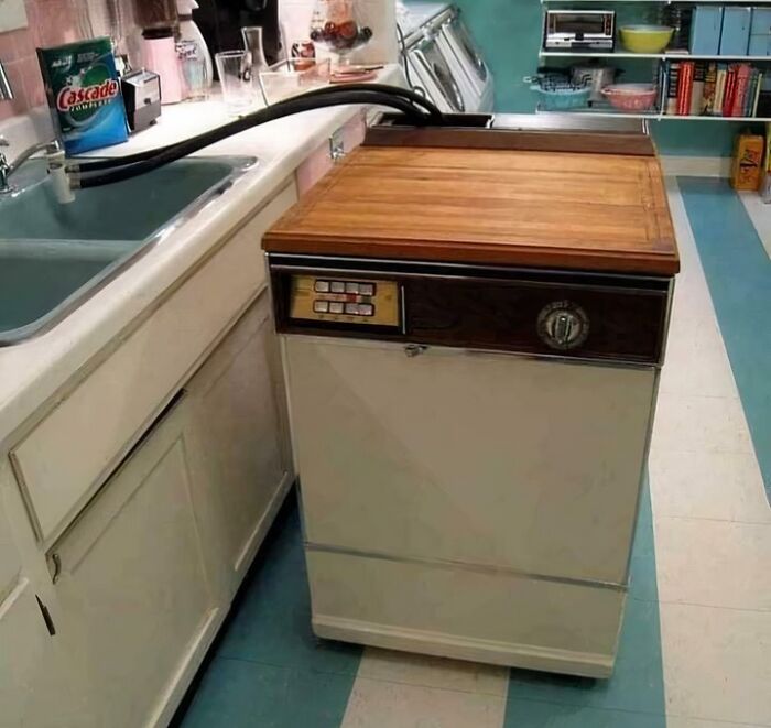 Vintage kitchen with a retro dishwasher, evoking childhood memories from the past.