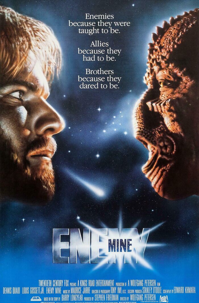 Movie poster for "Enemy Mine" showing a human and alien face-to-face with a starry space background.