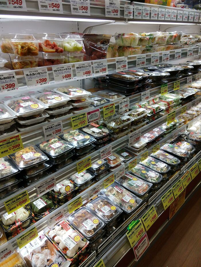 Variety of packaged meals in a Japanese convenience store, showcasing unique and interesting food options in Japan.