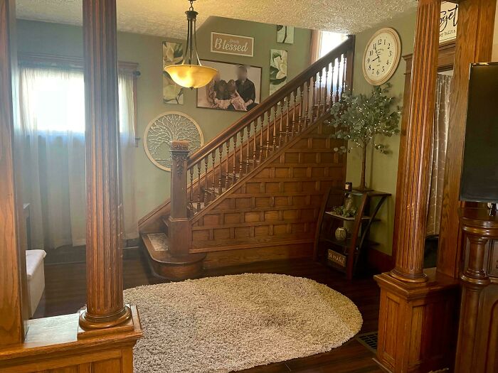 Cozy living space featuring beautifully decorated homes with wooden staircase, warm lighting, and stylish home decor accents.