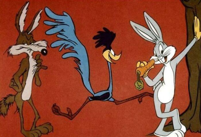 Three animated characters from childhood cartoons stand against a red background.