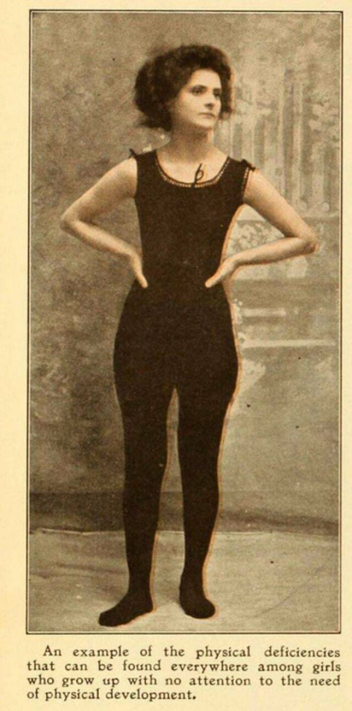 Victorian era woman in a black exercise outfit, standing with hands on hips, highlighting period physical fitness norms.