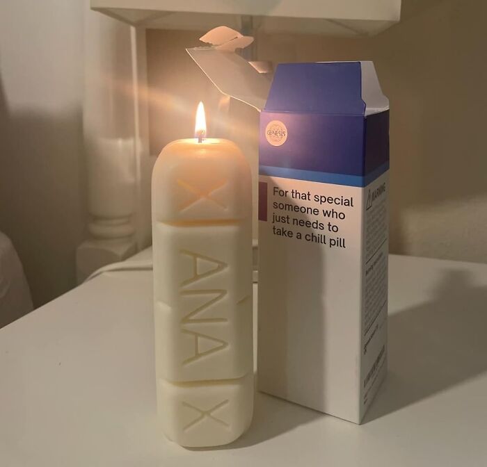 Candle shaped like a pill with humorous packaging, one of the funniest Amazon finds.
