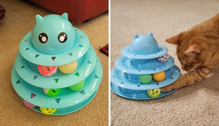 Cat playing with a blue tower toy, featuring multiple levels and colorful balls, showcasing innovative pet gadgets.