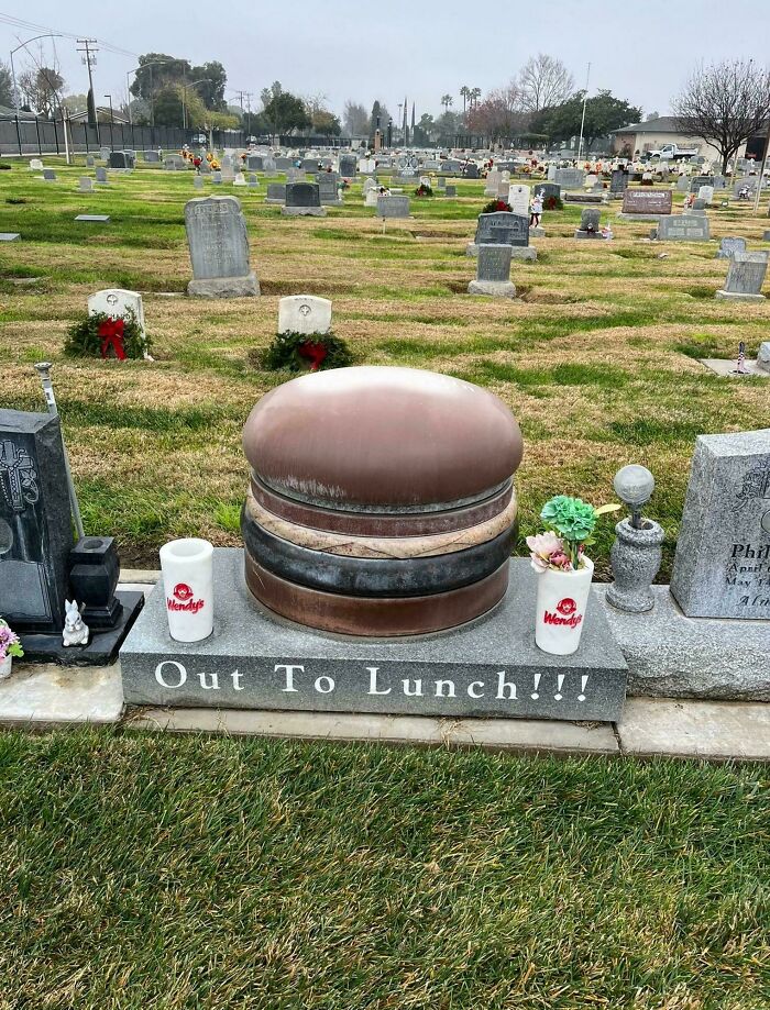 Gravestone designed as a giant hamburger with Wendy's cups, showing funny examples of awful taste but great e*******n.