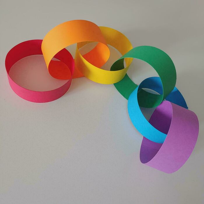 Colorful paper chain links on a white background, representing old-school memories.