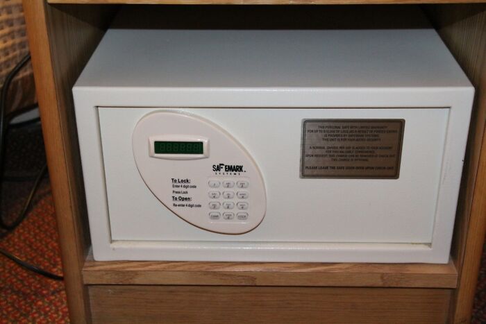 Hotel safe with keypad instructions possibly leading to hilarious misunderstandings due to unclear labeling.