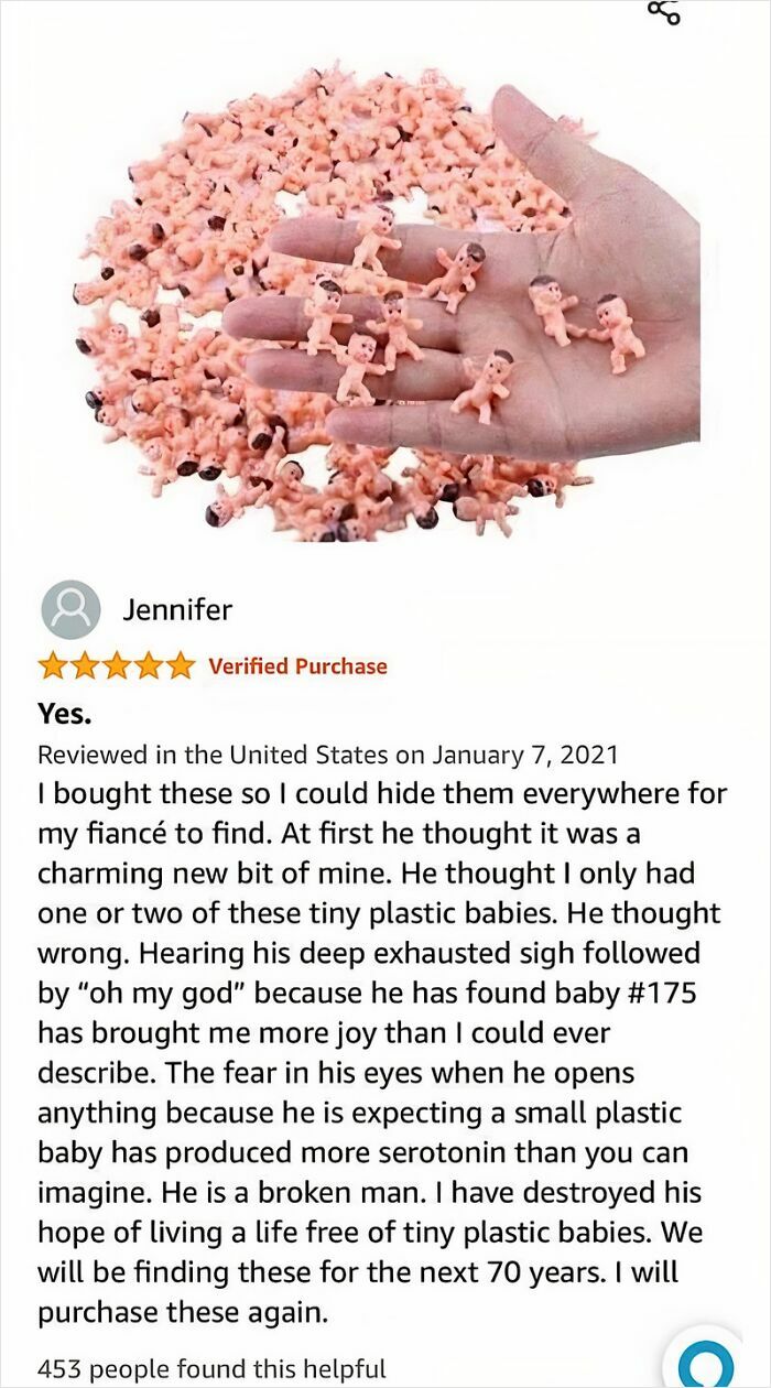 Hand holding tiny plastic babies with a funny online review about hiding them for someone to find.