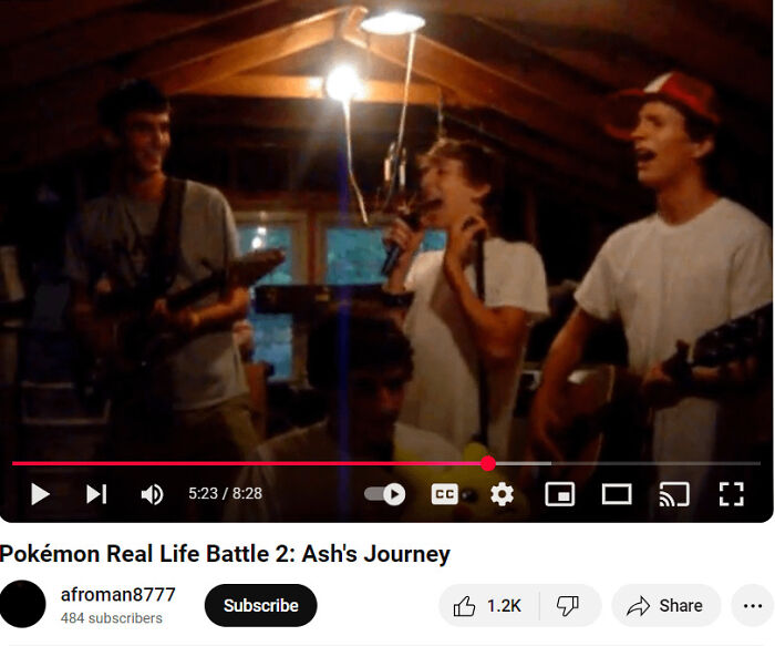 Teenagers playing guitars and singing in a dimly lit room, a relatable scene from a regrettable past photo.