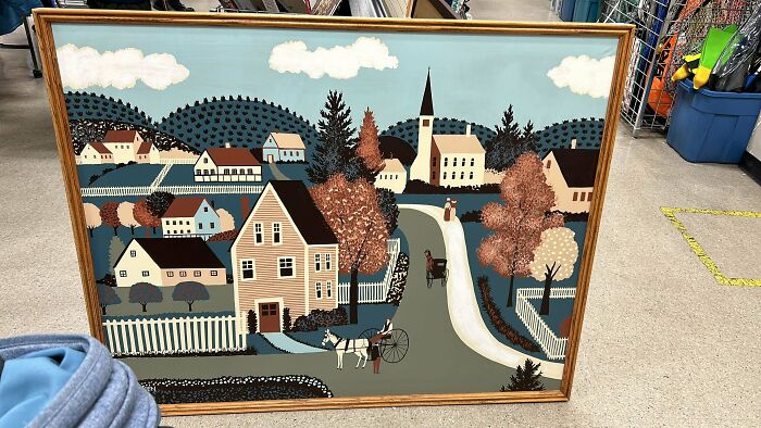 Painting of a quaint village scene with houses, trees, and a church, found while thrifting.