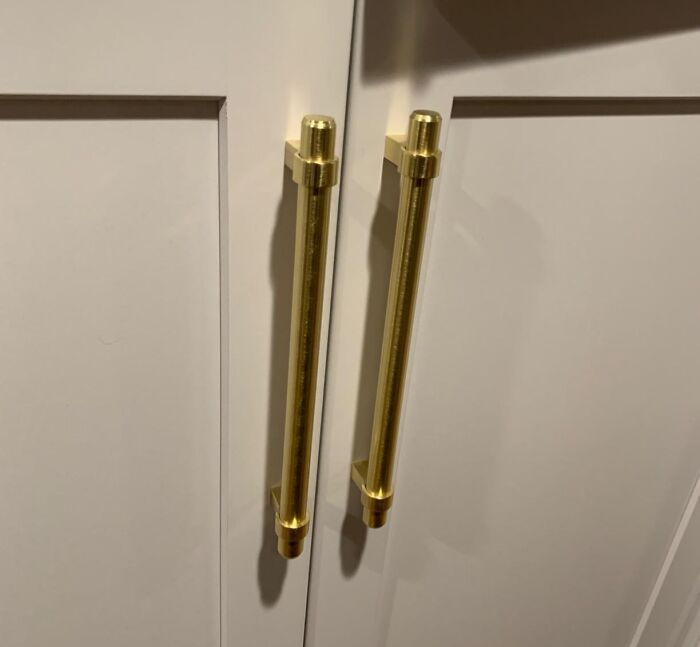 Gold handles on a cabinet, suitable for home DIY projects for not-handy people.
