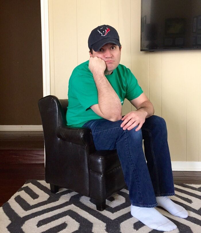 Person sitting on a small chair, demonstrating a low-quality item experience.