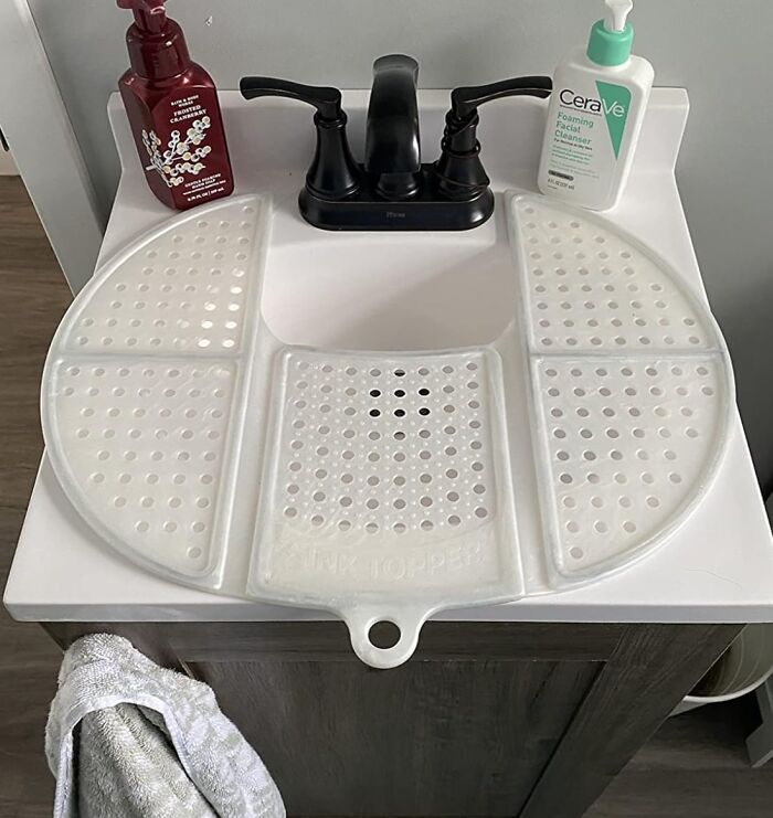 Sink topper on a bathroom vanity with soap dispensers, showcasing life saver organization hack for daily use.