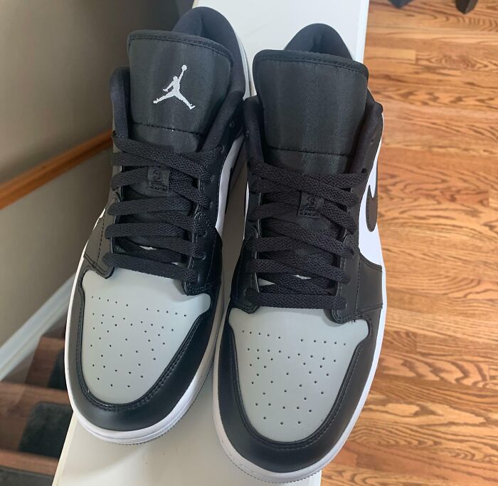 Black and white sneakers with a logo, illustrating low-quality items people bought.