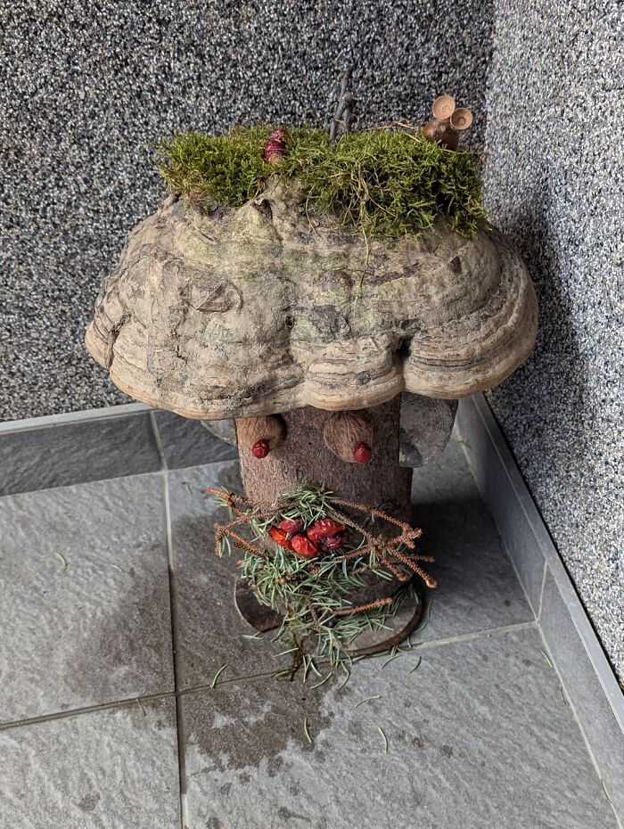 A quirky garden sculpture resembling a tree stump, possibly made by terrible neighbors.