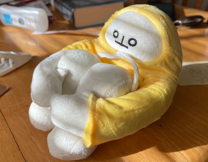 Cute plush toy in yellow outfit with a funny face, a perfect Amazon find.