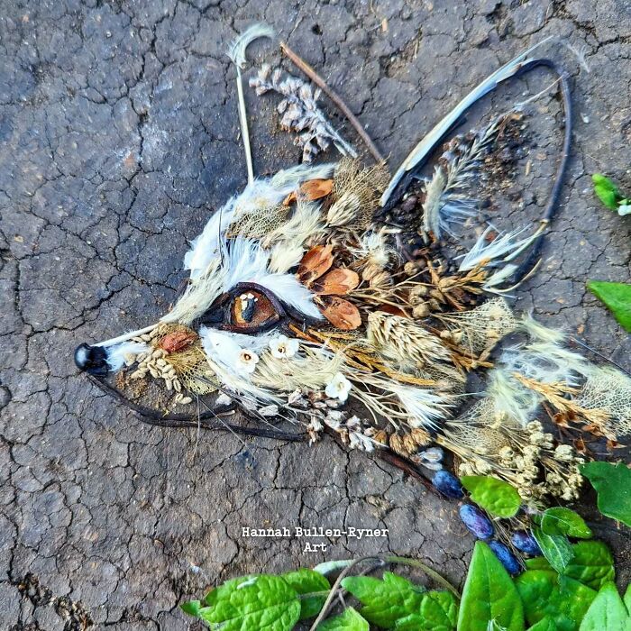 Detailed animal portrait using natural materials on earth by an artist, showcasing a fox created from leaves and twigs.