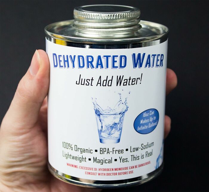 A can labeled "Dehydrated Water" held in hand, a funny Amazon find.