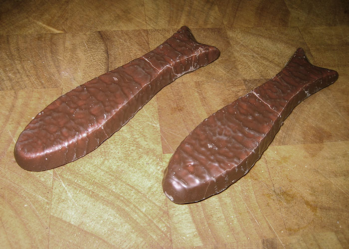 Chocolate fish shaped like a bizarre item, capturing the essence of wild 911 calls in dispatcher memories.