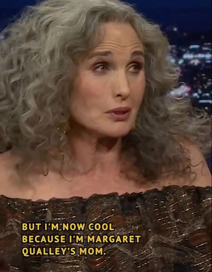 Woman with curly gray hair discussing "reverse nepotism" on a talk show.