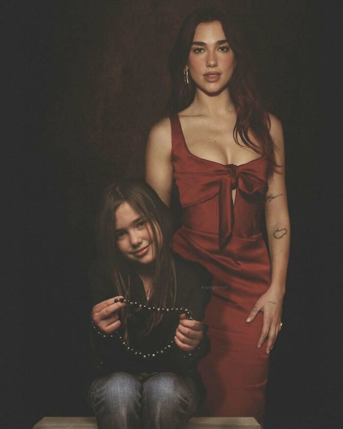Celebrities photoshopped with younger selves, woman in red dress stands beside younger self holding a necklace.