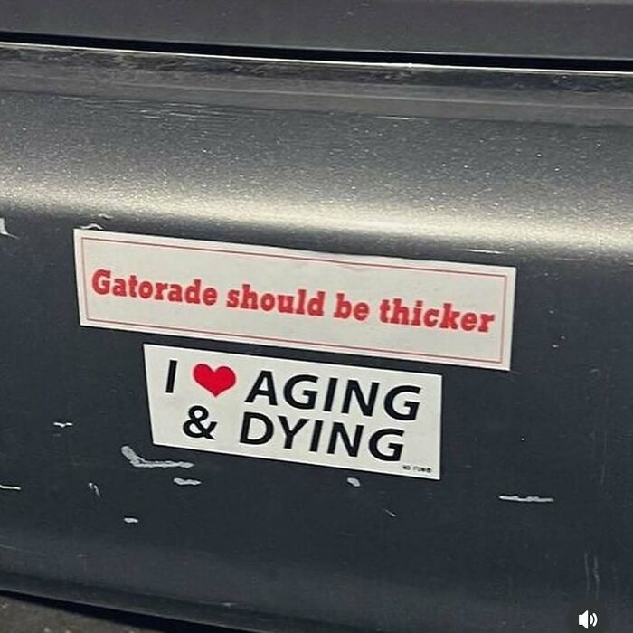 Confusing and funny photo of a car bumper with stickers reading "Gatorade should be thicker" and "I ♥ AGING & DYING".