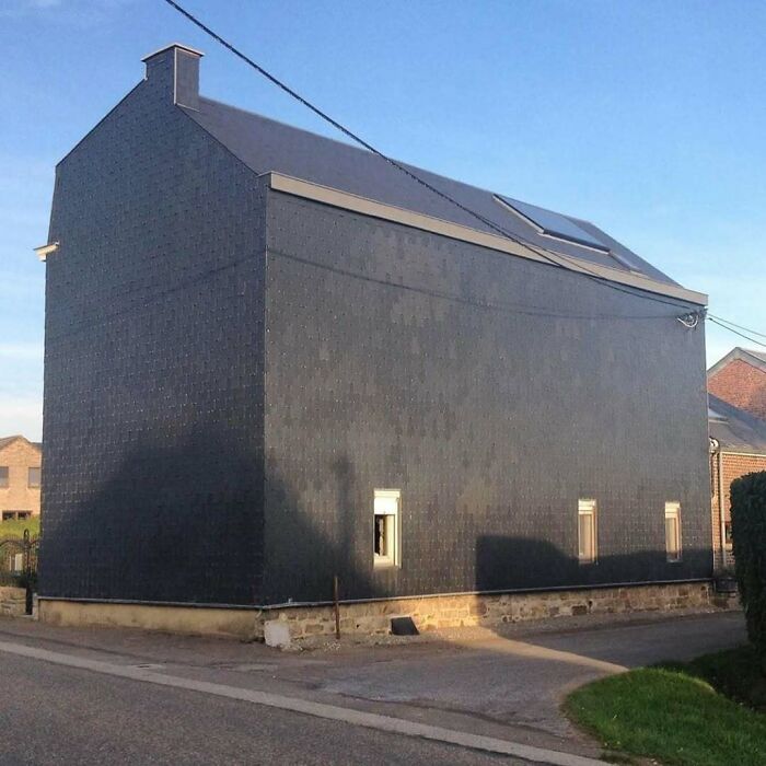 Unusual house with a flat wall exterior, an example of hilariously bad architecture in Belgium.