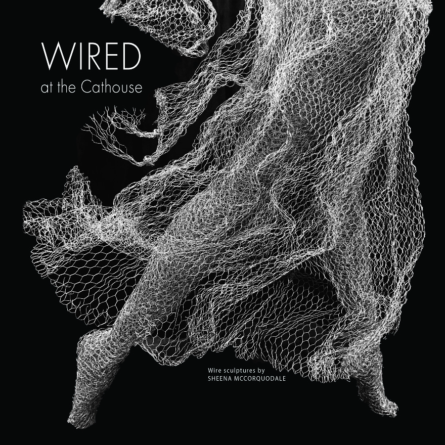 Wire sculpture showcasing intricate design, created from chicken wire, displayed at the Cathouse exhibit.