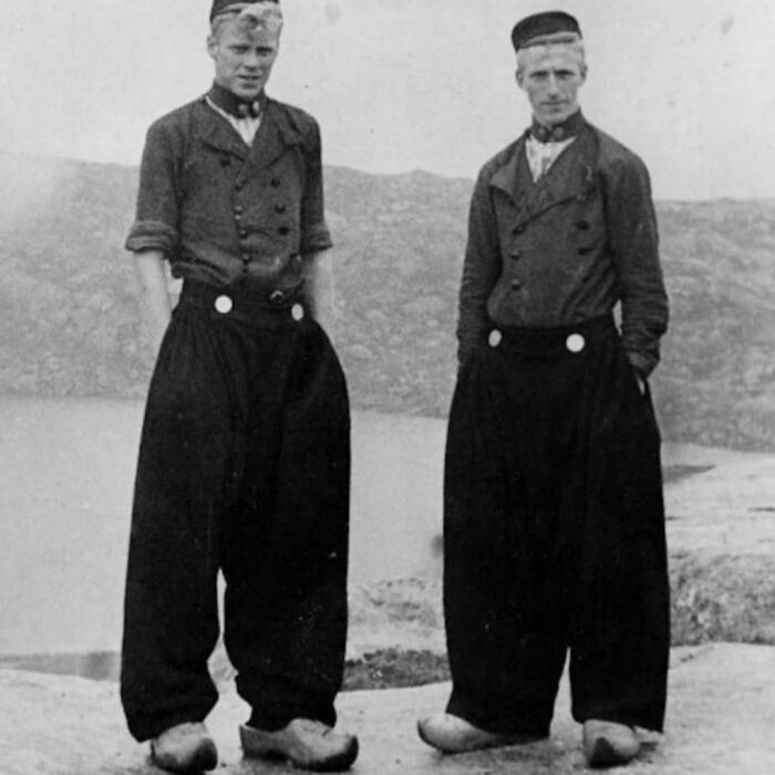 Two young men from the past wearing traditional clothing, showcasing history cool kids style.