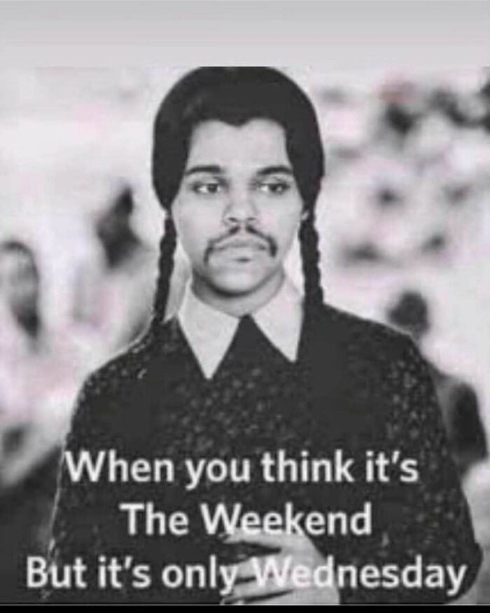 Person with braids and mustache looking unimpressed, captioned "When you think it's the weekend but it's only Wednesday"—office meme.