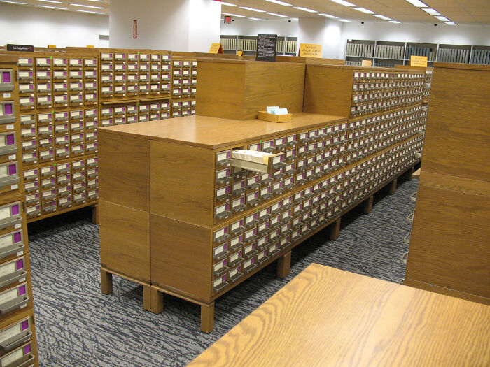 Old-school items: Wooden library card catalog, evoking memories of traditional research methods.