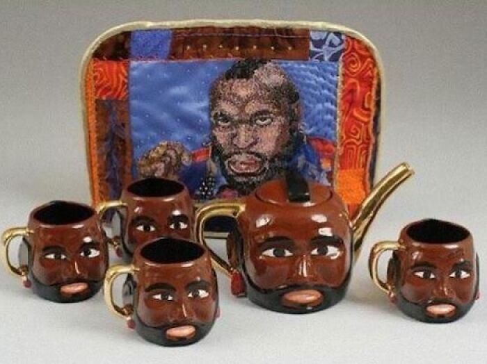Bizarre teapot set with faces and a matching colorful quilt backdrop from eclectic Instagram page.