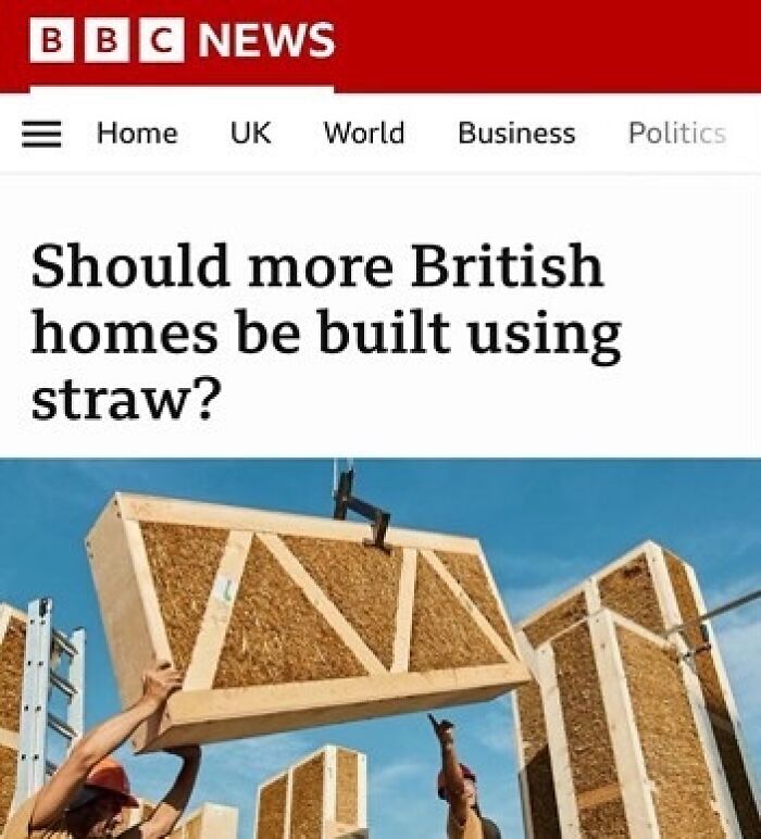 "BBC News headline about British homes with workers lifting straw construction materials."