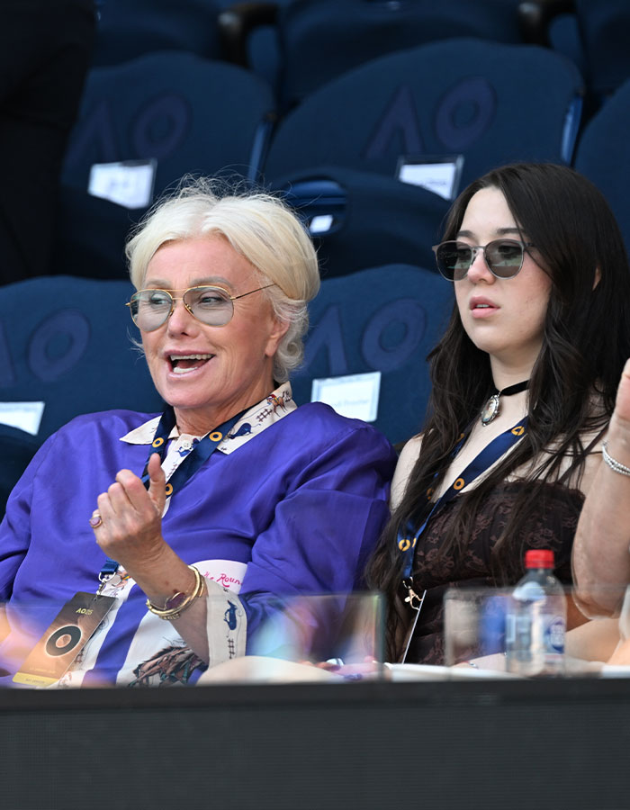 Deborra-Lee Furness at Australian Open, wearing sunglasses and a purple shirt, laughing with a companion. Deborra-Lee Furness at Australian Open, wearing sunglasses and a purple shirt, laughing with a companion.