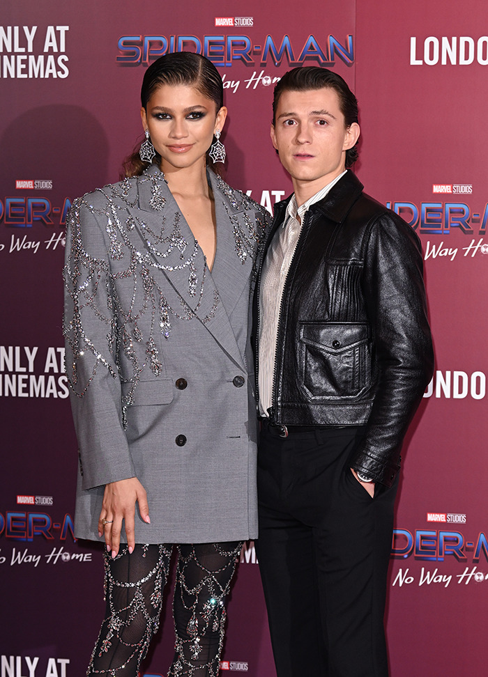 Tom Holland and Zendaya at the "Spider-Man: No Way Home" event, showcasing Hollywood style and chemistry.
