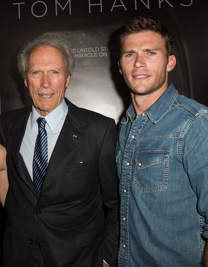 Clint Eastwood and his son standing together, both in formal attire, at a movie premiere event. Clint Eastwood and his son standing together, both in formal attire, at a movie premiere event.