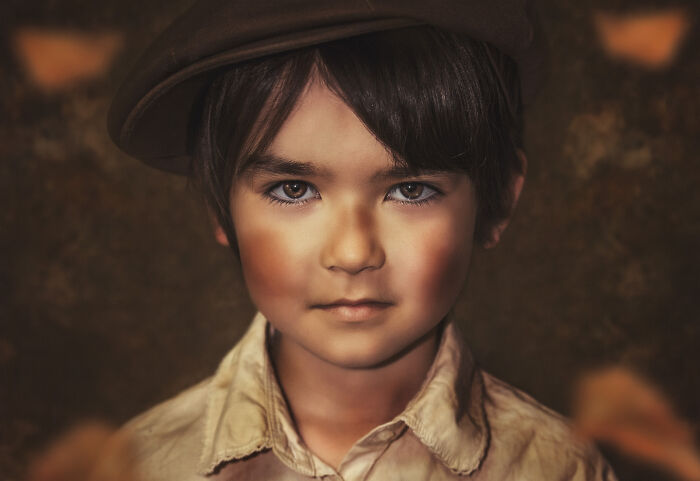 Child in vintage attire and cap, appearing confident and serene, part of creative photo series on overcoming personal struggles.