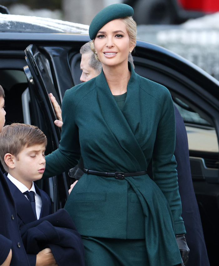 A woman in a green coat and hat at a presidential inauguration, in a controversial outfit.