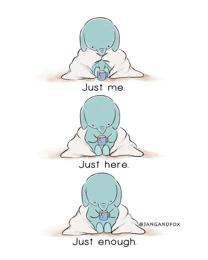 Wholesome comic by Joanne Ang showing a blue character with a mug, wrapped in a blanket, with captions: Just me. Just here. Just enough.