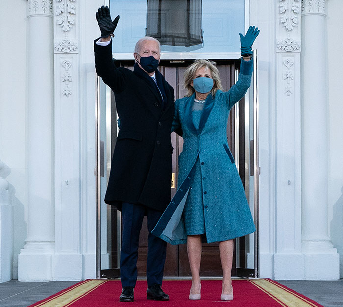 First Lady in teal outfit at inauguration, a focus of fashion comparisons by netizens.