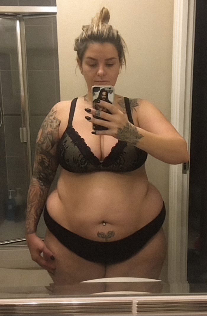 Kelly Wynne poses for a bathroom mirror selfie in undergarments. Kelly Wynne poses for a bathroom mirror selfie in undergarments.