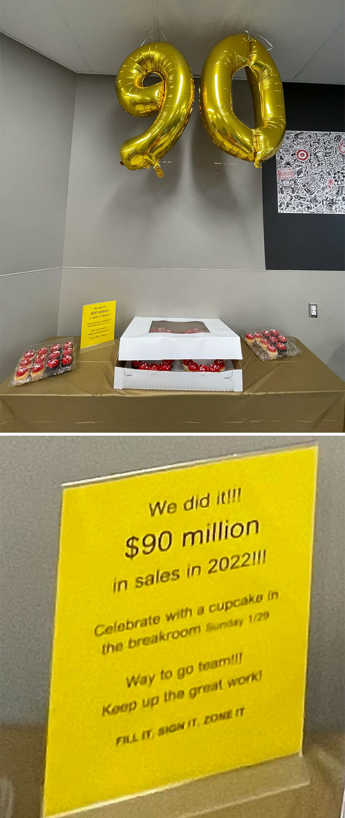 Gold balloons shaped as "90" above a table with company gifts, cupcakes, and a sign.