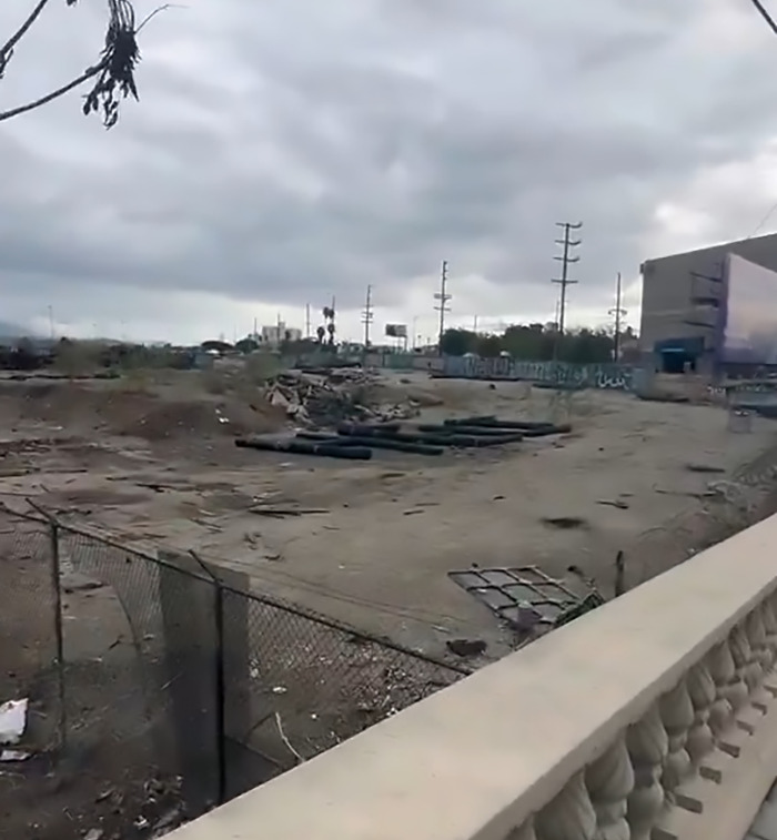 Abandoned area with mysterious "Help" signs, sparking conspiracy theories.