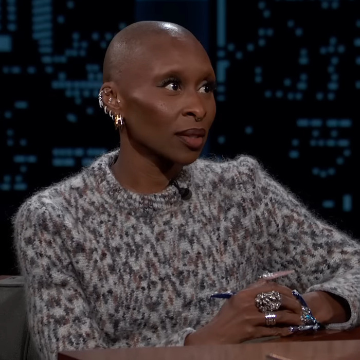Cynthia Erivo in a patterned sweater on a talk show. Cynthia Erivo in a patterned sweater on a talk show.