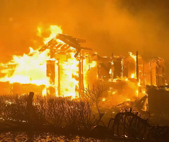 A house engulfed in flames amid LA wildfires, highlighting controversy over celebrities ignoring water limits. A house engulfed in flames amid LA wildfires, highlighting controversy over celebrities ignoring water limits.