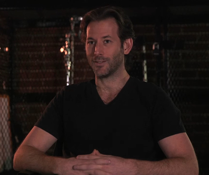 Jeff Baena in a black shirt sitting indoors. Jeff Baena in a black shirt sitting indoors.